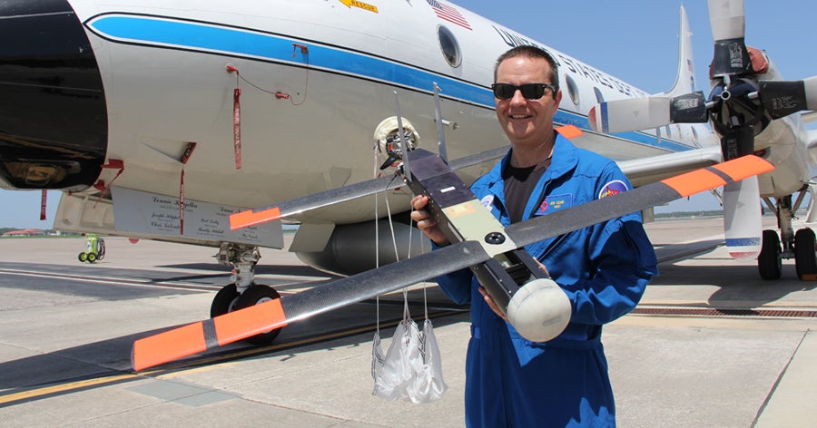 NOAA scientist Joe Cione holding Coyote drone​   ​