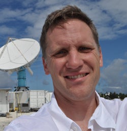 Eric Maloney with radar dish